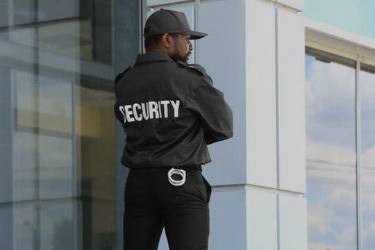 Security guard stationed outside a residential estate building